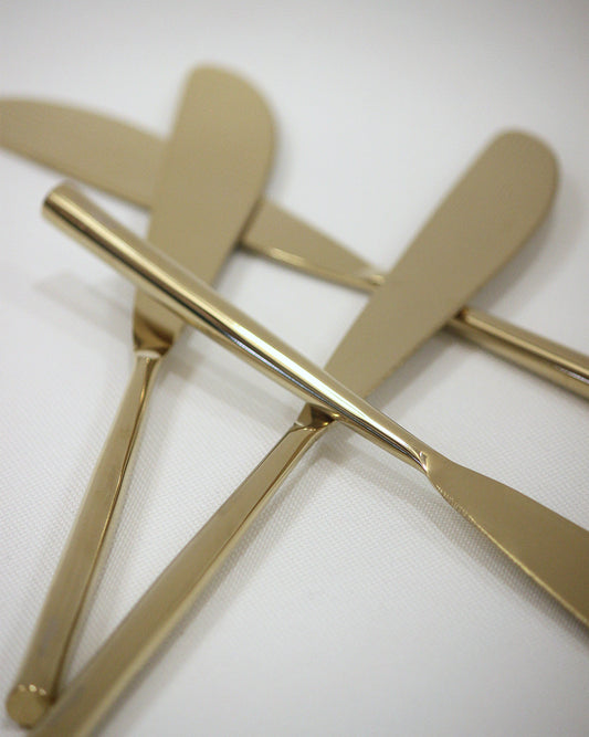 Gold Shinny Coated knife with round handle . 