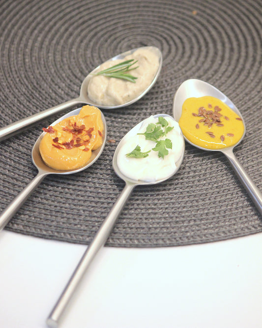 Close-up of a deep-bowl metal table spoon ensuring accurate measurement in the kitchen.