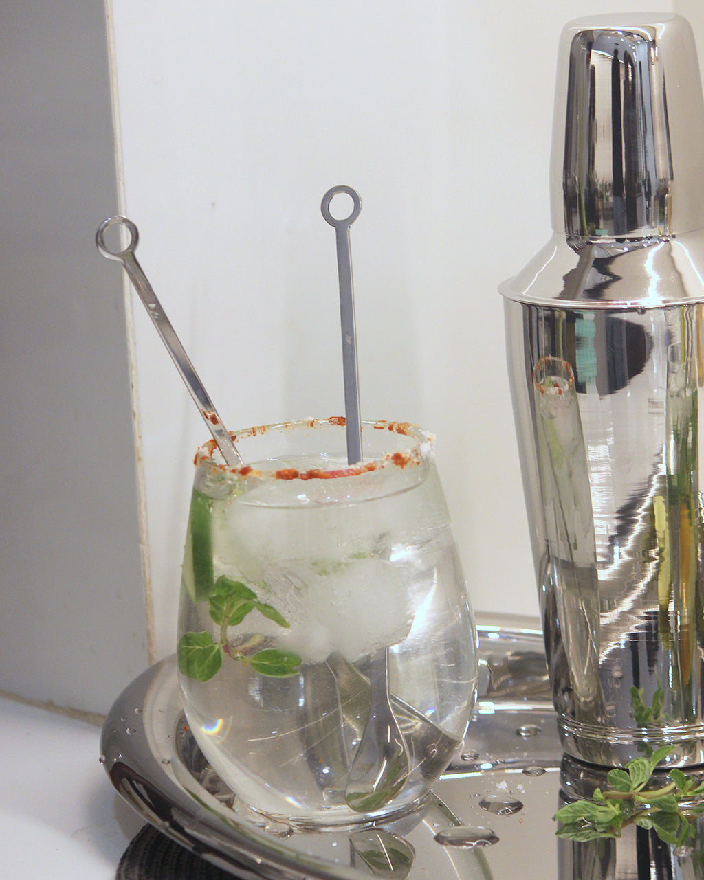 Stainless steel cocktail stirrer mixed drink with silver polish . 